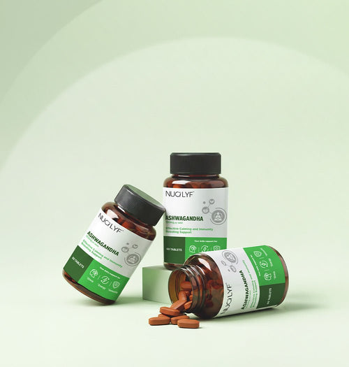 Ashwagandha 500mg supplement bottles with tablets on a light green background