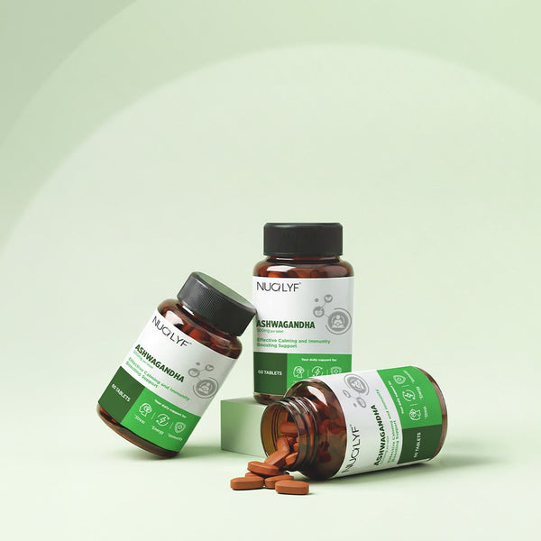 Ashwagandha 500mg supplement bottles with tablets on a light green background