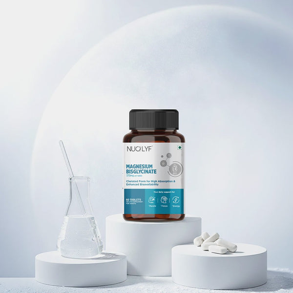 Magnesium bisglycinate supplement bottle with tablets and a laboratory flask on white podiums.