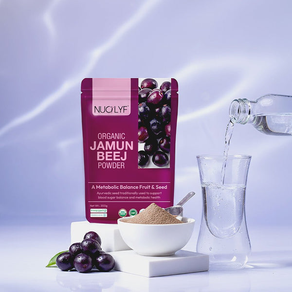 Organic jamun beej powder pouch with fresh jamun fruit, bowl of powder, and glass of water
